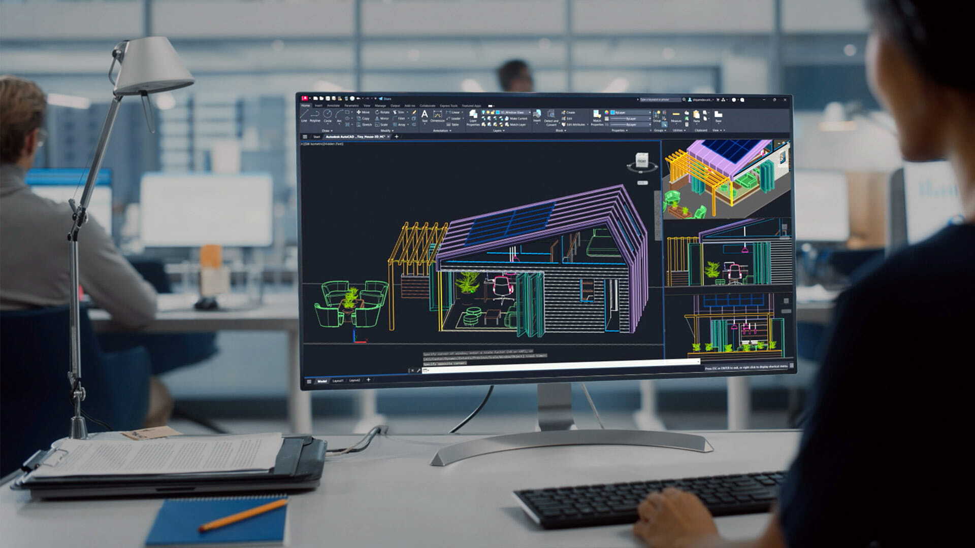 Autodesk software in use on a desktop workstation.