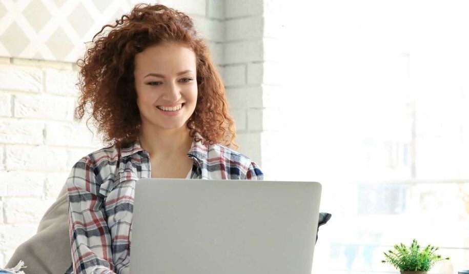 happy woman using Copilot Chat